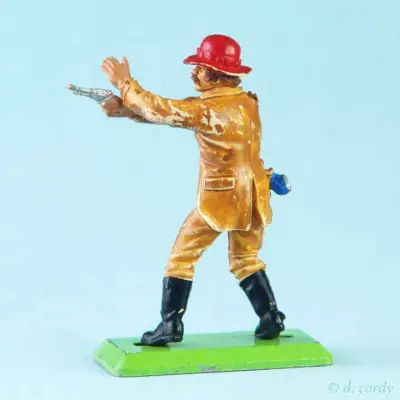 Rückseite einer Britains Cowboy Figur mit Pistole